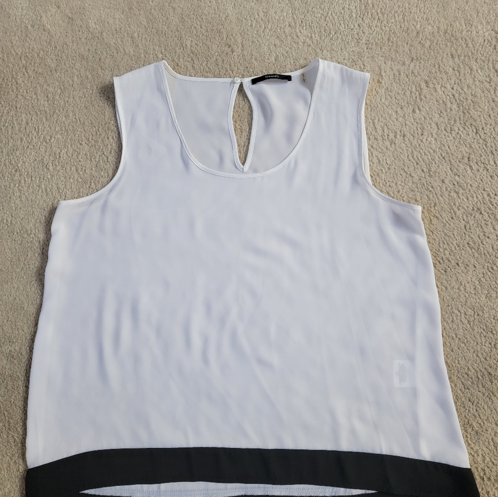 White trimmed in black top